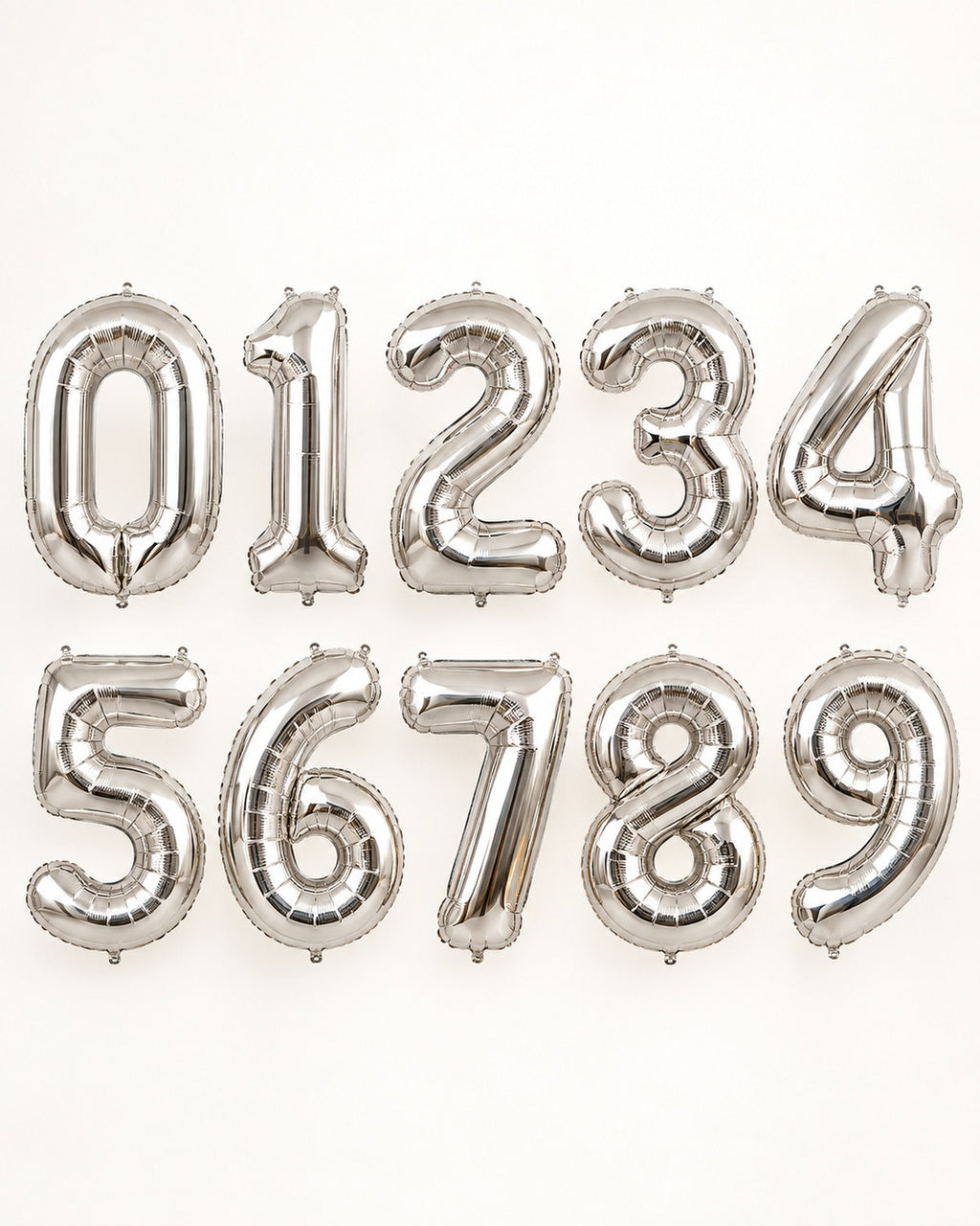 Silver foil number balloons from 0 to 9, arranged in two rows