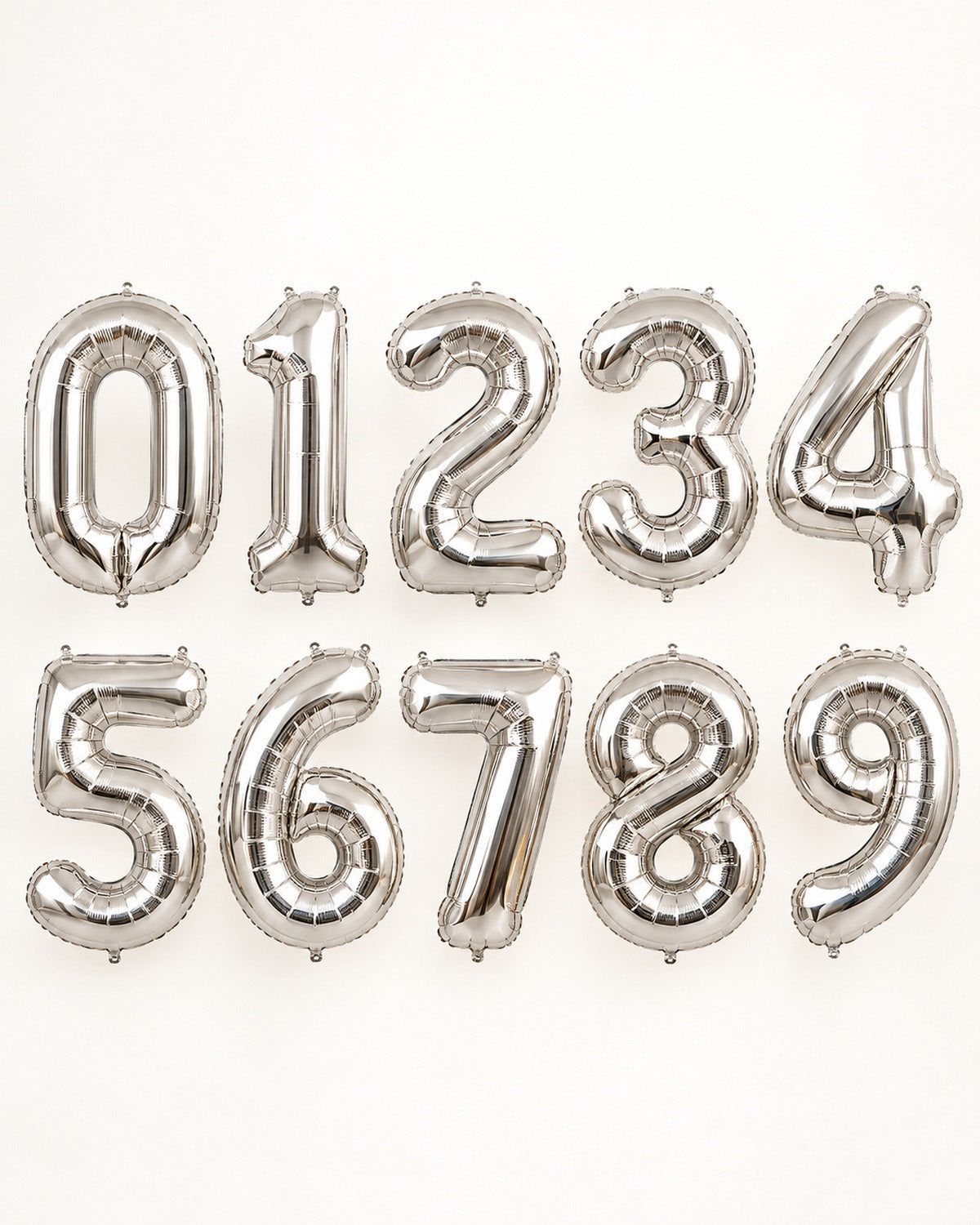 Silver foil number balloons from 0 to 9, arranged in two rows