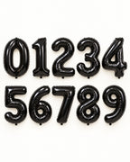 Black foil number balloons from 0 to 9, arranged in two rows