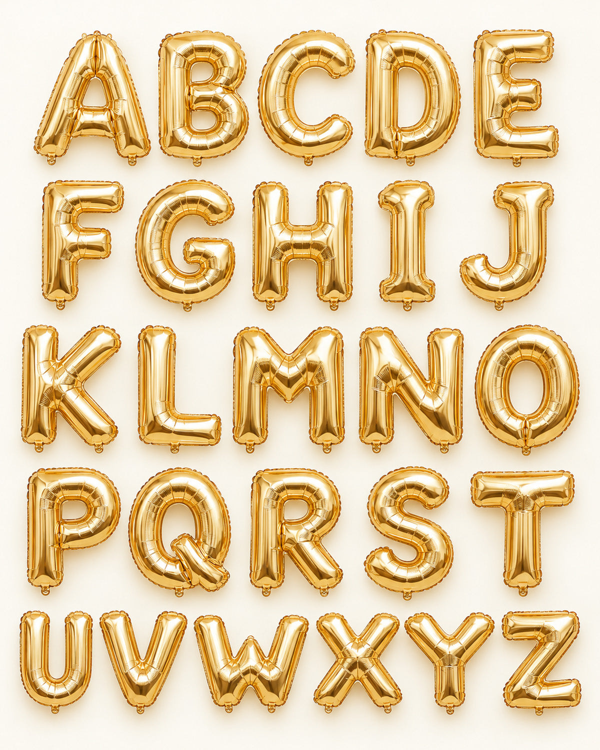 Champagne-gold foil letter balloons A-Z arranged in alphabetical rows
