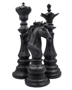 King, queen, and knight chess-piece candles