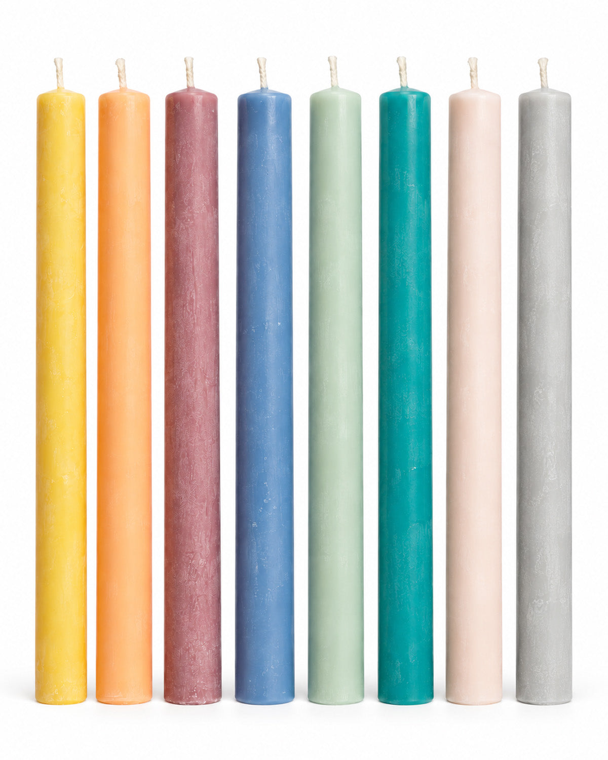 Taper candles in yellow, peach, mauve, dusty blue, sage, teal, blush, and light gray