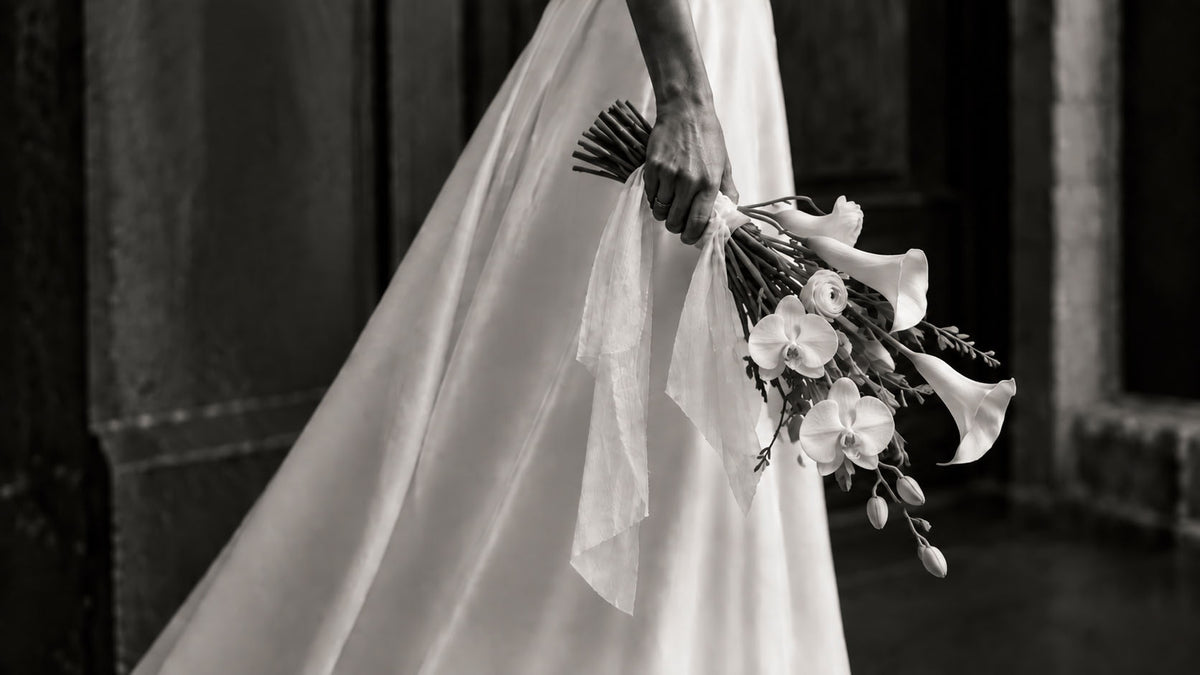 Bride holding a white wedding bouquet